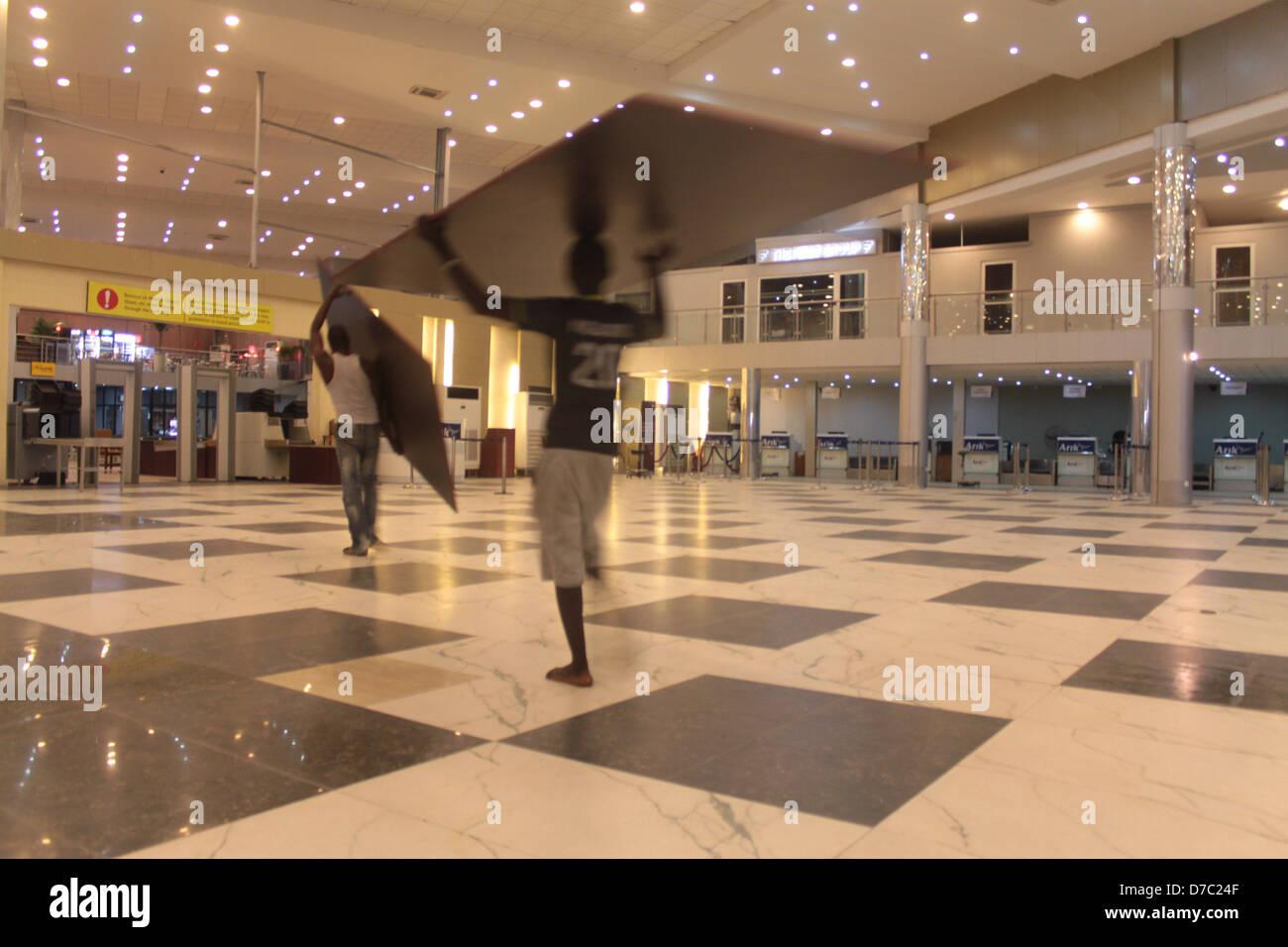 Workmen at the departure lounge of the <b>Murtala Muhammed</b> ...